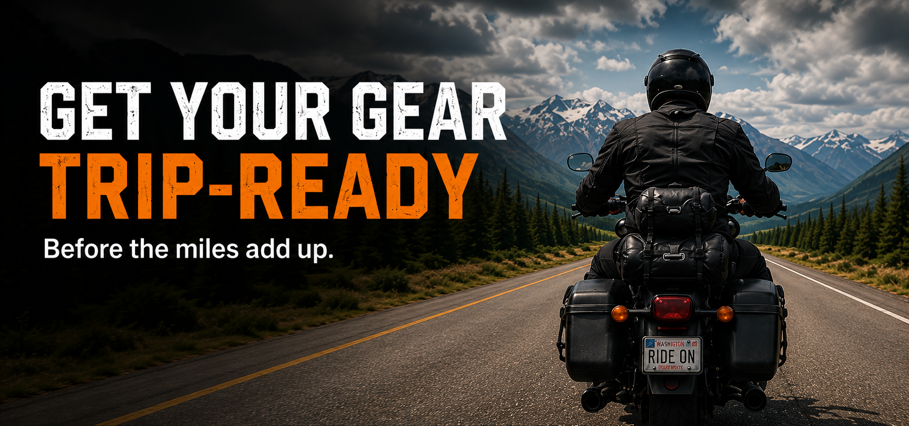 Motorcyclist riding a loaded touring motorcycle toward mountain scenery with the words Get Your Gear Trip-Ready.