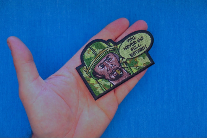 Ivamis Full Retard Patch P7778 in green and black, shown on a hand for scale