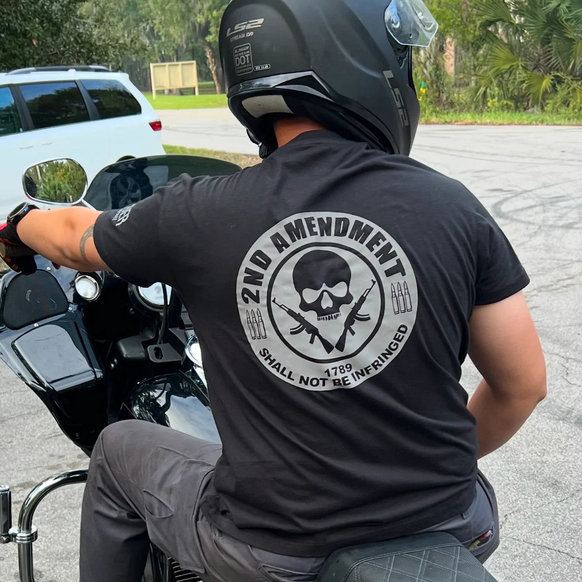 Derringer Men's 2nd Amendment Shirt CP-602 in black, back graphic worn on motorcycle