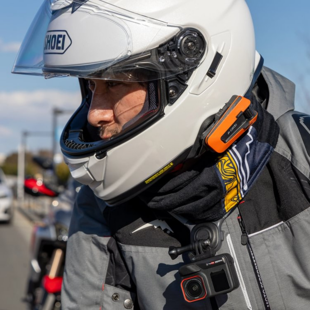 Cardo PACKTALK EDGE KTM orange communicator helmet installation close-up