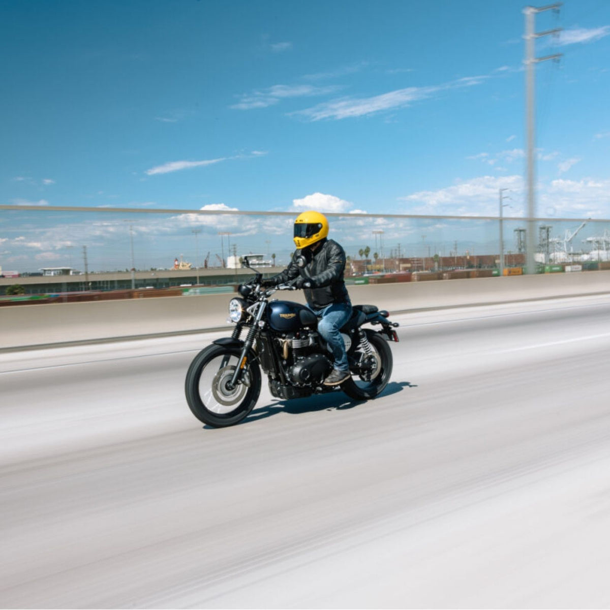 HJC V10 Solid Full Face Helmet Yellow helmet on a rider, side riding view