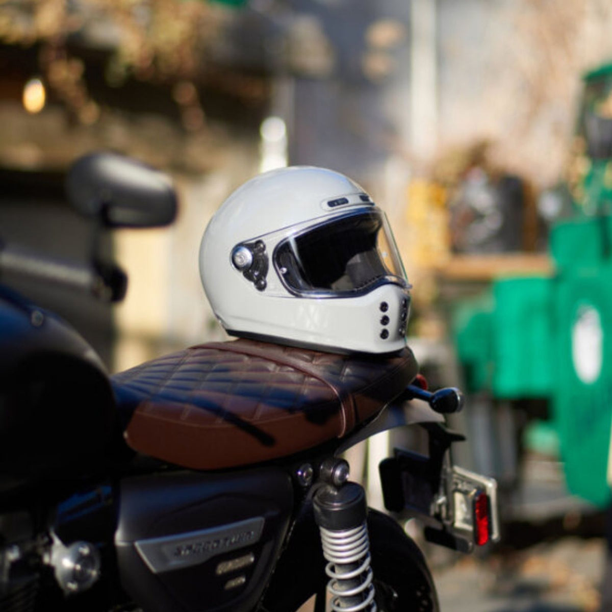 HJC V10 Solid Full Face Helmet White helmet displayed on a motorcycle