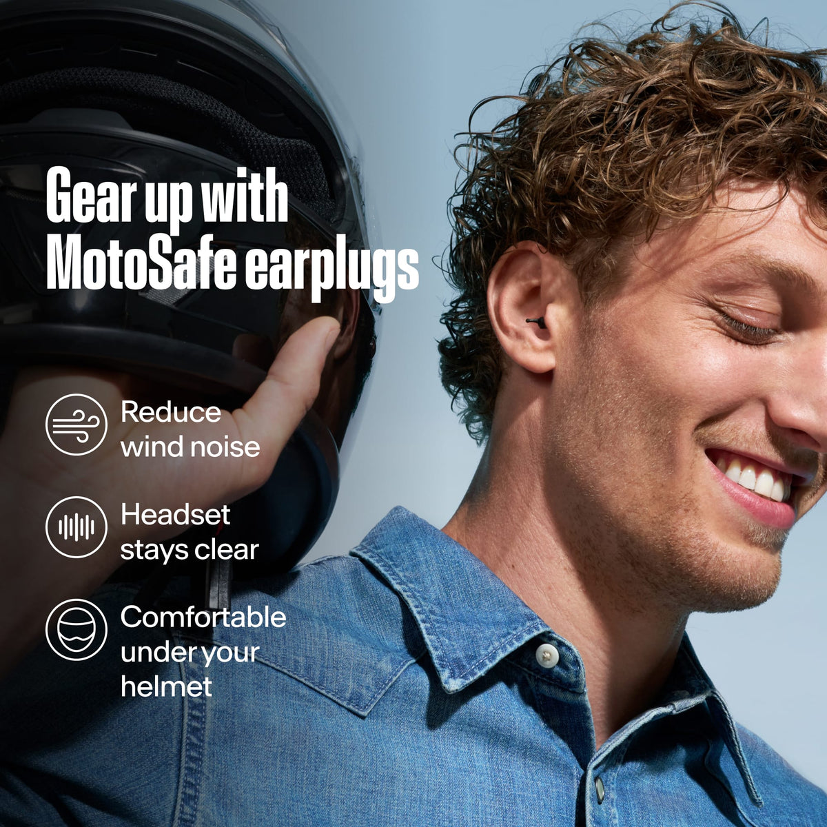 Rider holding a motorcycle helmet with Alpine MotoSafe Tour earplugs