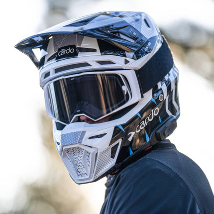 Rider wearing the Cardo VENTURE off-road helmet with goggles