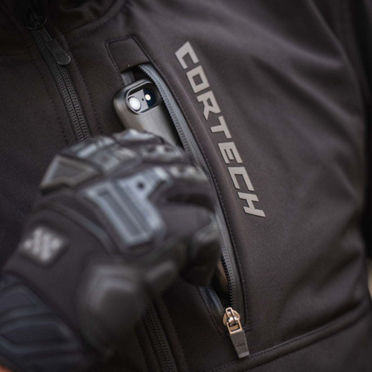 Cortech Meta Hoodie in Black, chest pocket in use