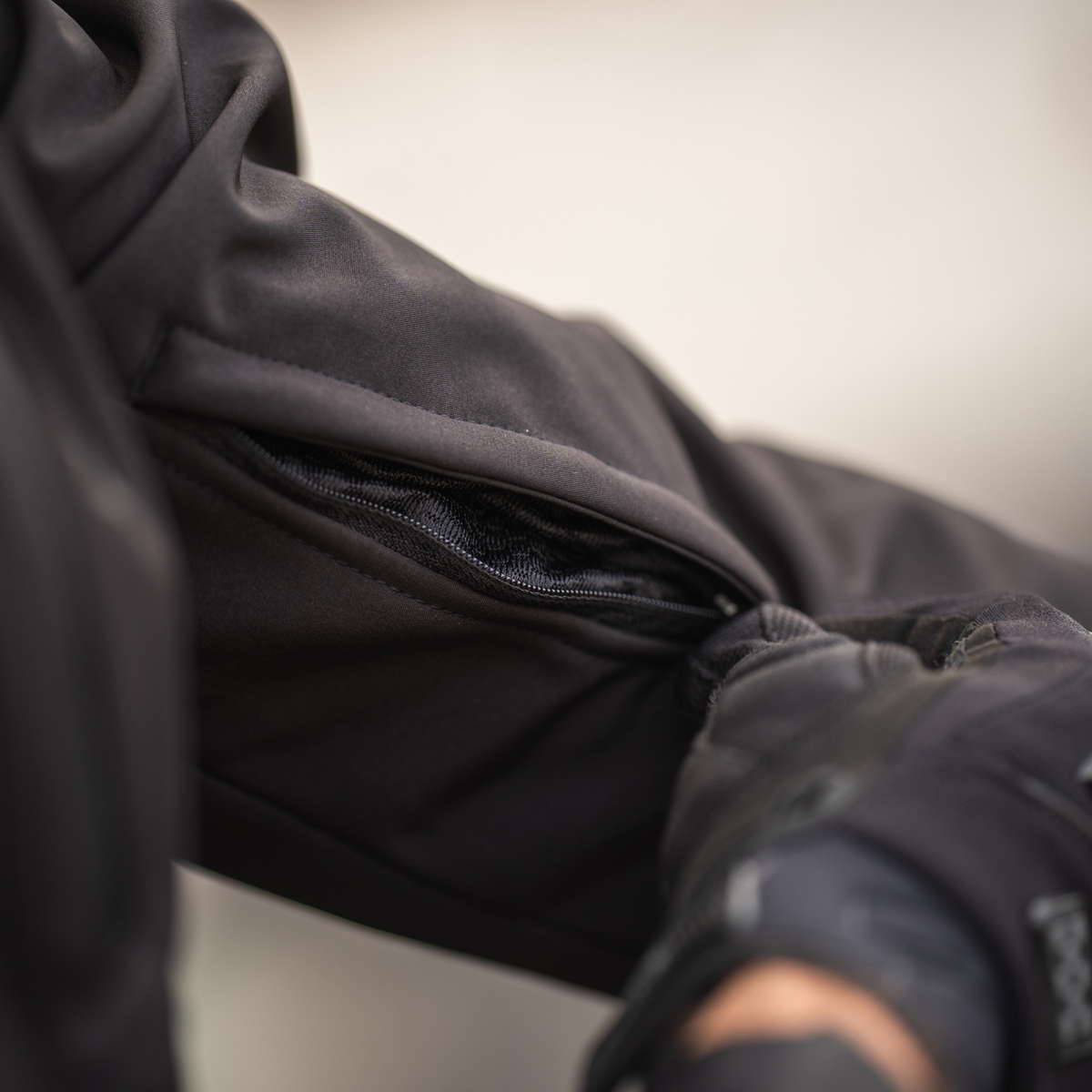 Cortech Meta Hoodie in Black, arm vent in use