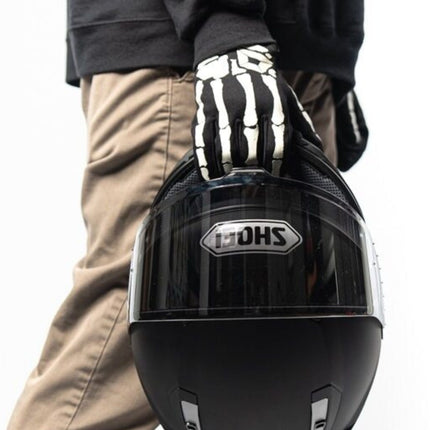 Cortech Standard Issue Bones Gloves in Black/White - worn while holding a helmet