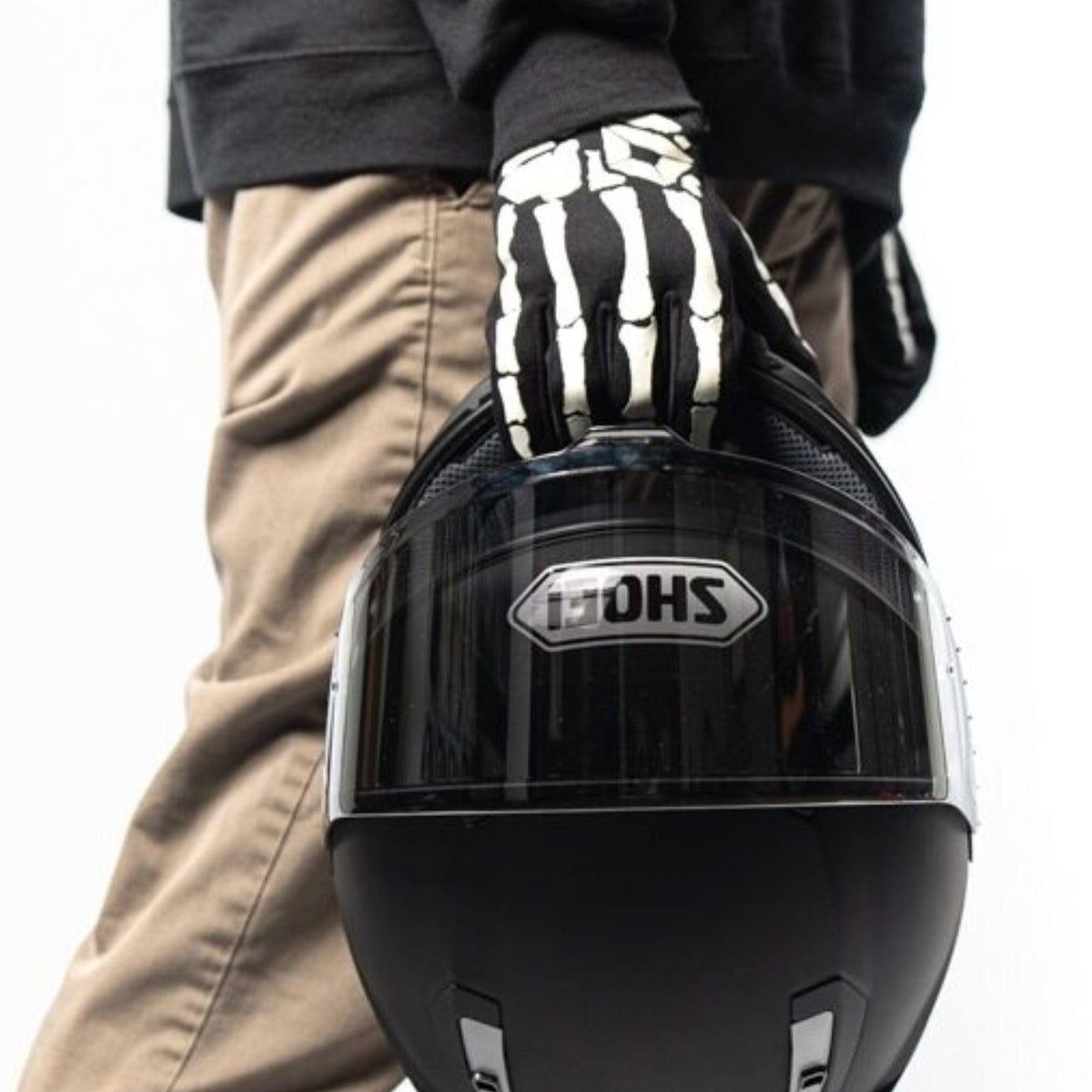 Cortech Standard Issue Bones Gloves in Black/White - worn while holding a helmet