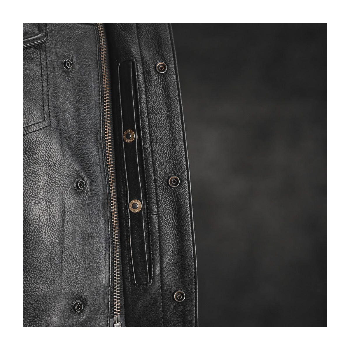 Sharp Shooter covered center zipper and snap closure detail