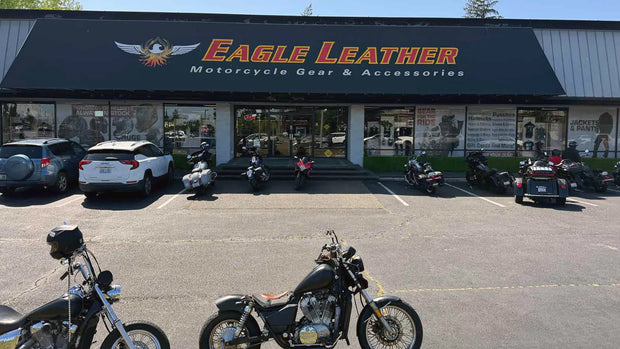 Motorcycles parked outside Eagle Leather’s Lakewood store under sunny skies