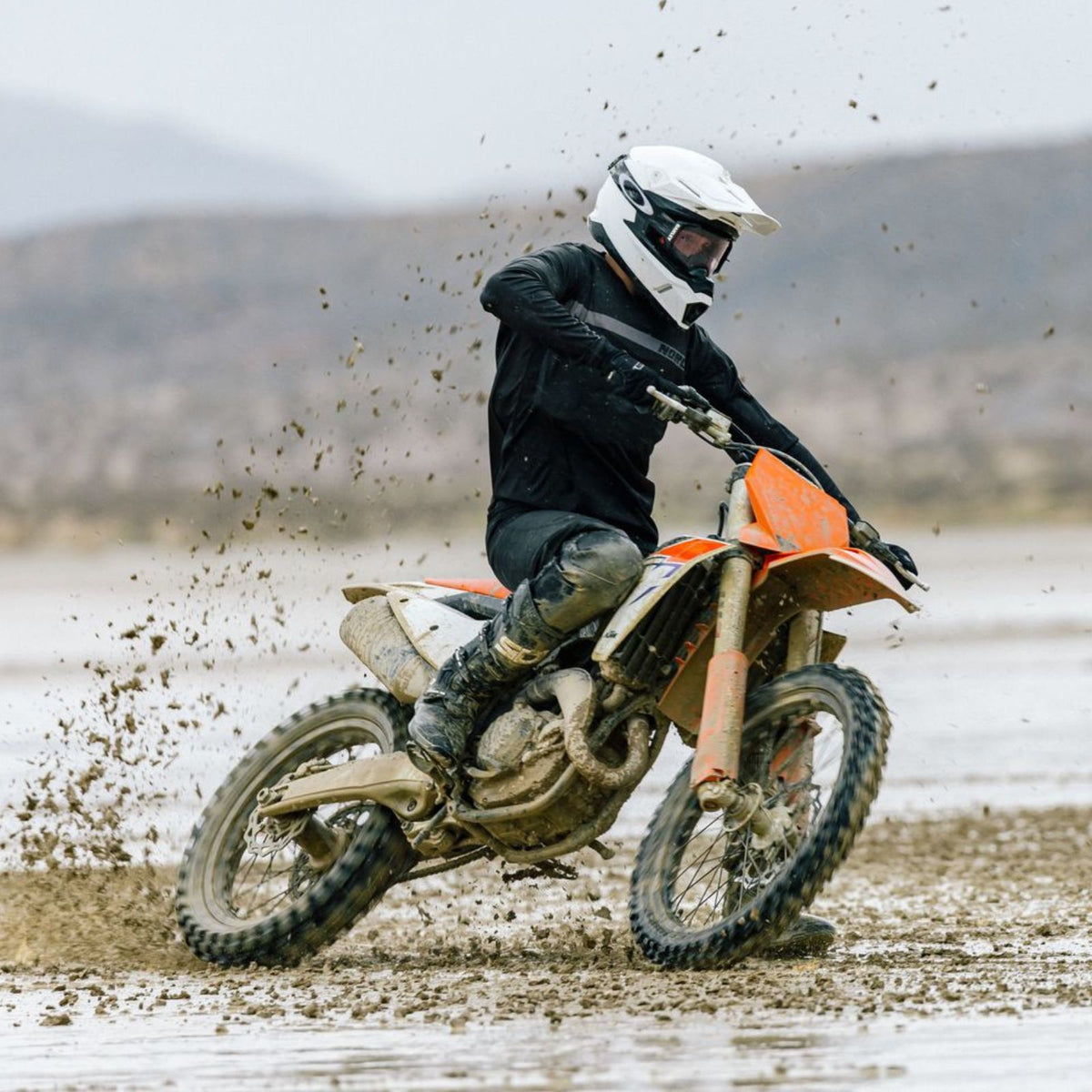 HJC C50 Pearl White helmet in off-road riding action