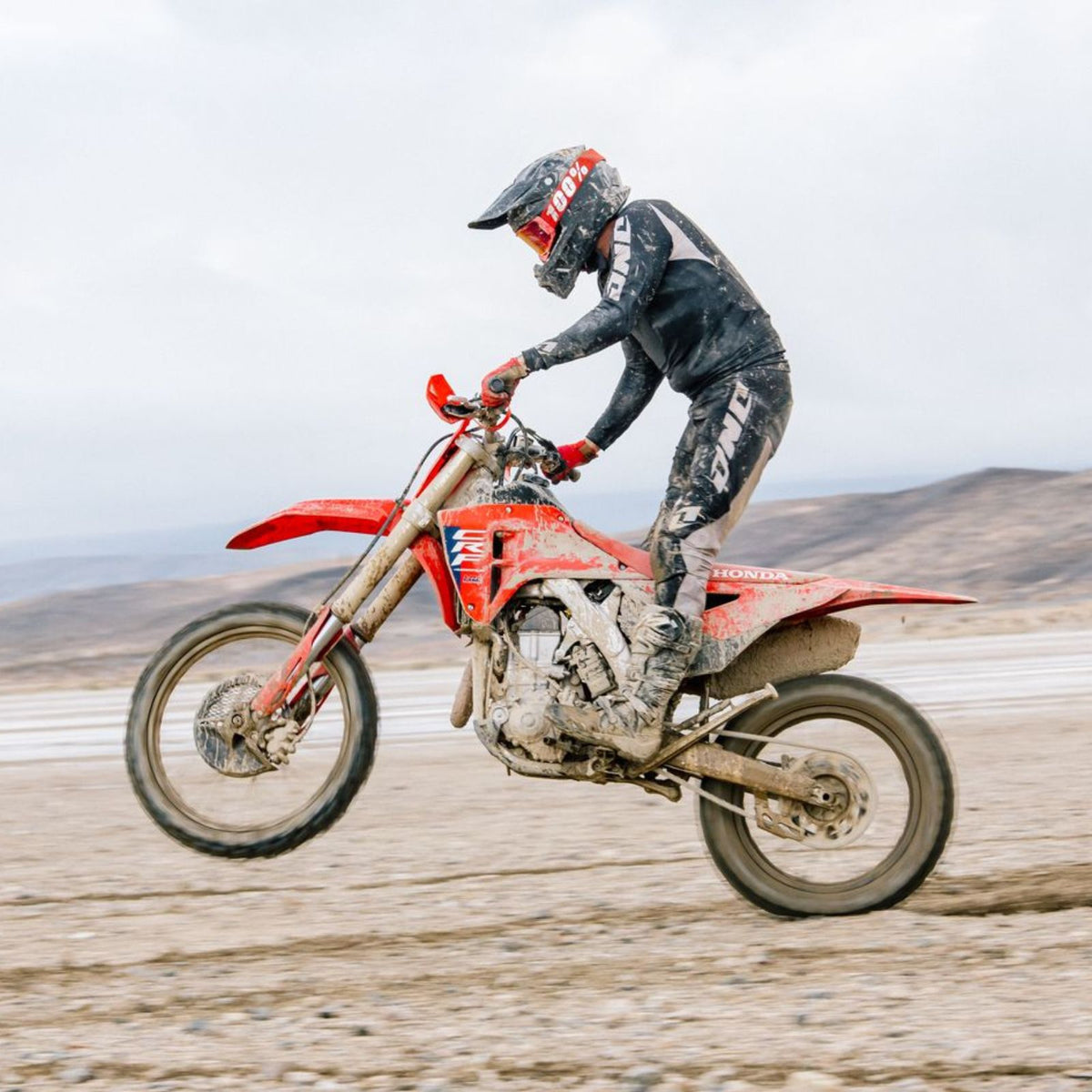 HJC C50 Pearl White helmet worn by a motocross rider