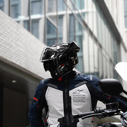 Rider wearing the HJC F100 Carbon helmet in open-face configuration