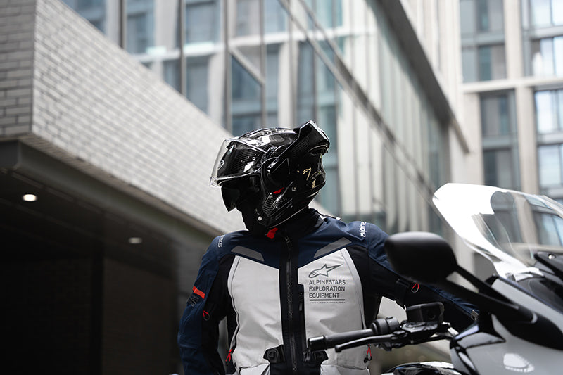 Rider wearing the HJC F100 Carbon helmet in open-face configuration