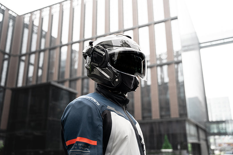 Rider wearing the HJC F100 Carbon helmet in an urban setting