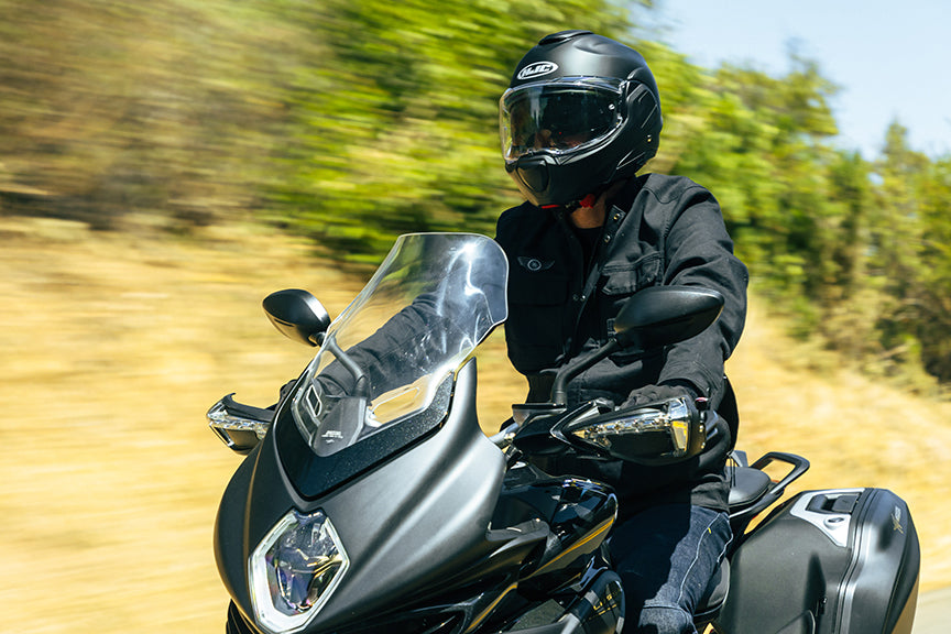 HJC F100 Solid helmet on a rider, front three-quarter riding view