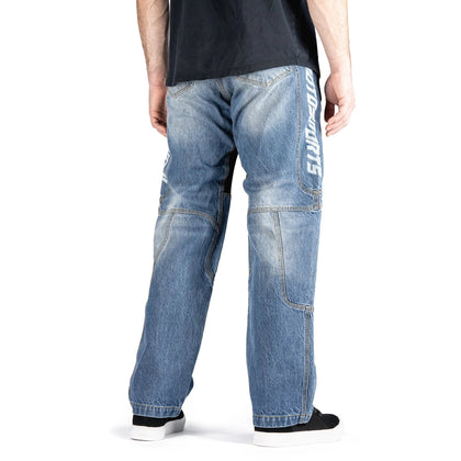 Rider wearing ICON Hooligan Jeans in Blue back view