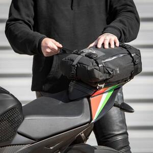 Kriega US 10 Drypack being secured to a motorcycle tail