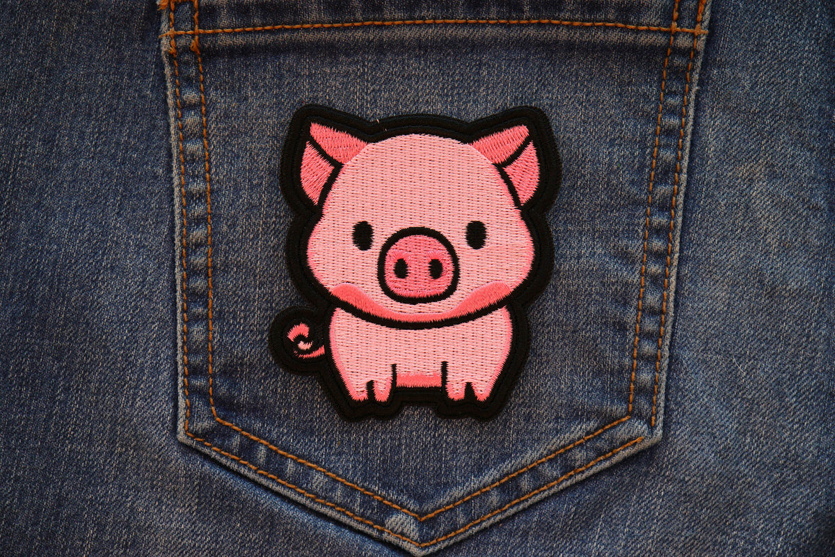 Little Piggy embroidered patch displayed on denim
