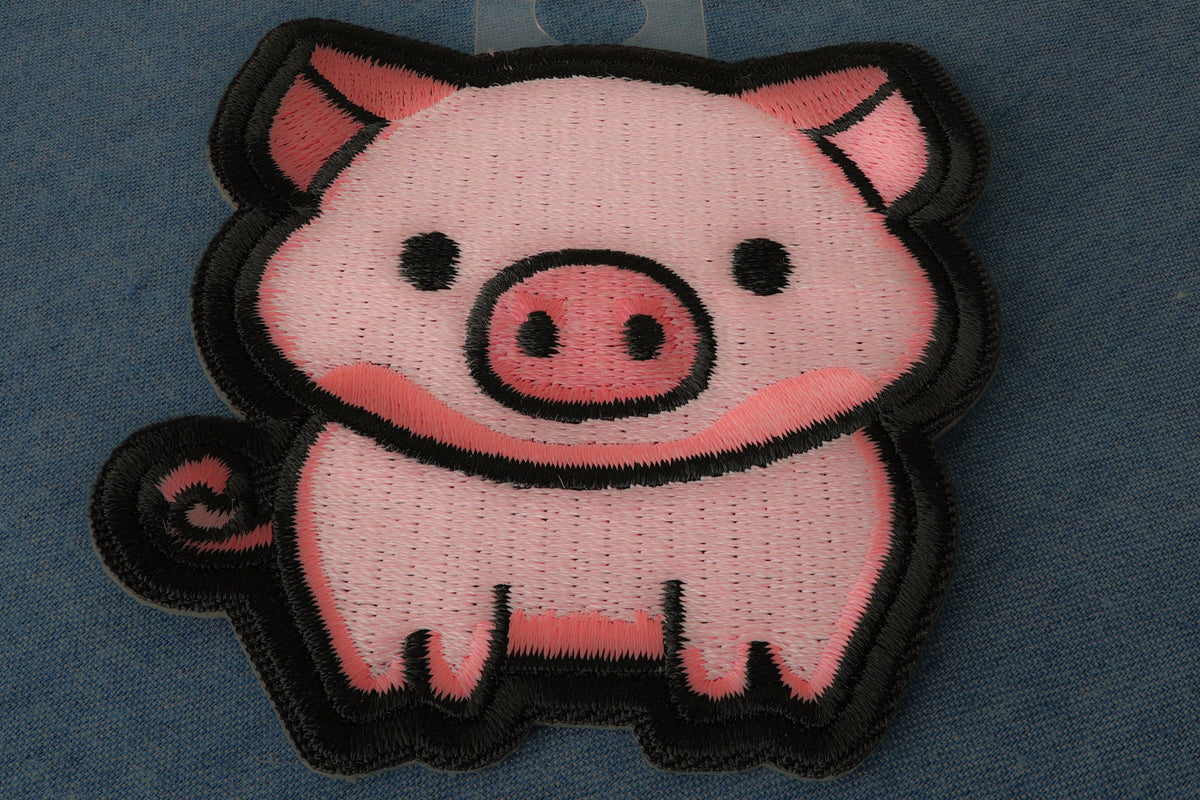 Back of Little Piggy embroidered patch showing iron on backing