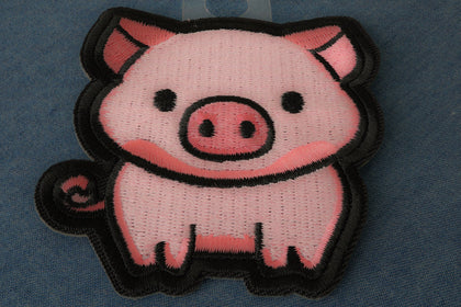 Back of Little Piggy embroidered patch showing iron on backing