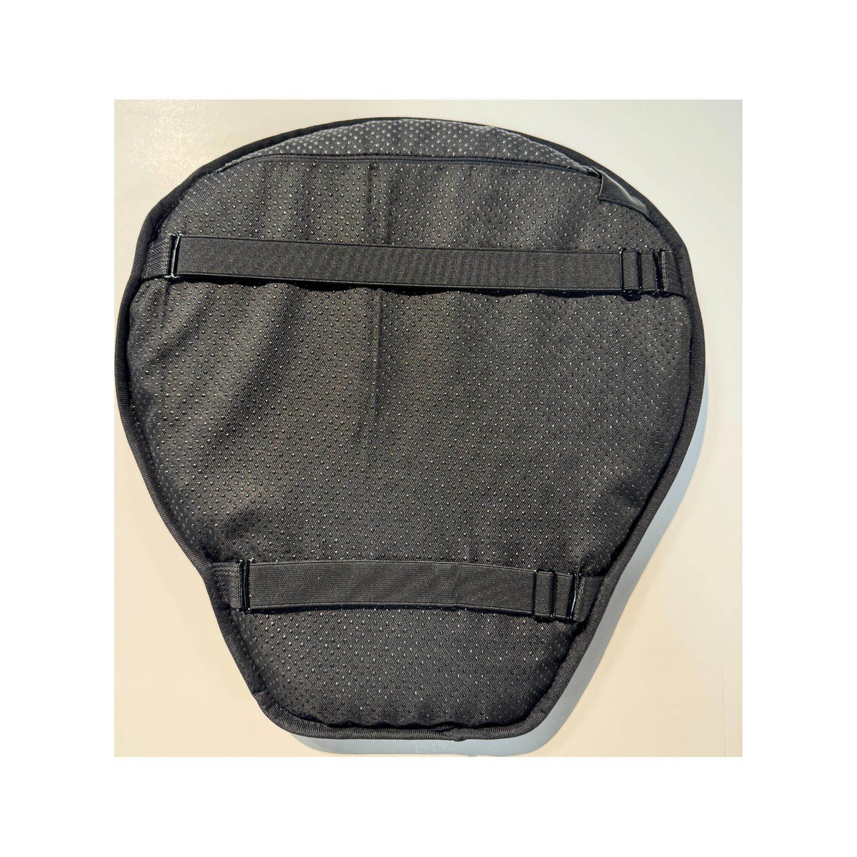 Underside of black Motorcycle Seat Air Gel Cushion cover showing anti-slip surface and two elastic straps