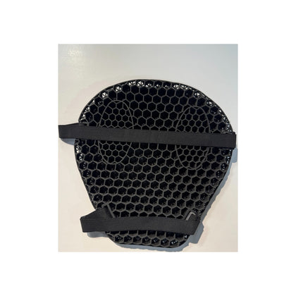 Underside of black TPE honeycomb motorcycle seat cushion showing two retention straps