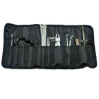 Motorcycle tool kit roll with assorted wrenches, hex keys, pliers, screwdrivers, and zip ties neatly organized in a black fabric pouch.
