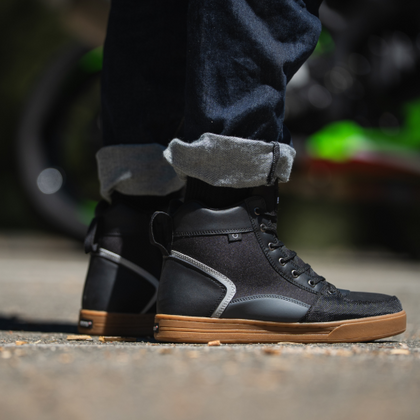 NORU Men’s Tori Boots in black with gum soles worn off the motorcycle
