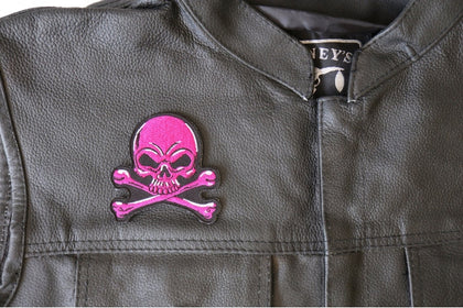Pink Skull and Crossbones patch installed on a leather vest