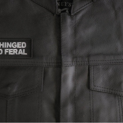 Unhinged and Feral patch installed on a leather vest