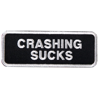 Crashing Sucks Patch White Border 4 Inch: Description
"CRASHING SUCKS" embroidered in white lettering on a black background w