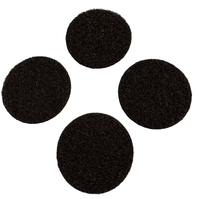 Set of four round black adhesive Velcro pads for securing motorcycle gear or accessories.