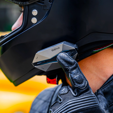 Rider operating the Sena 60X glove friendly joystick controls
