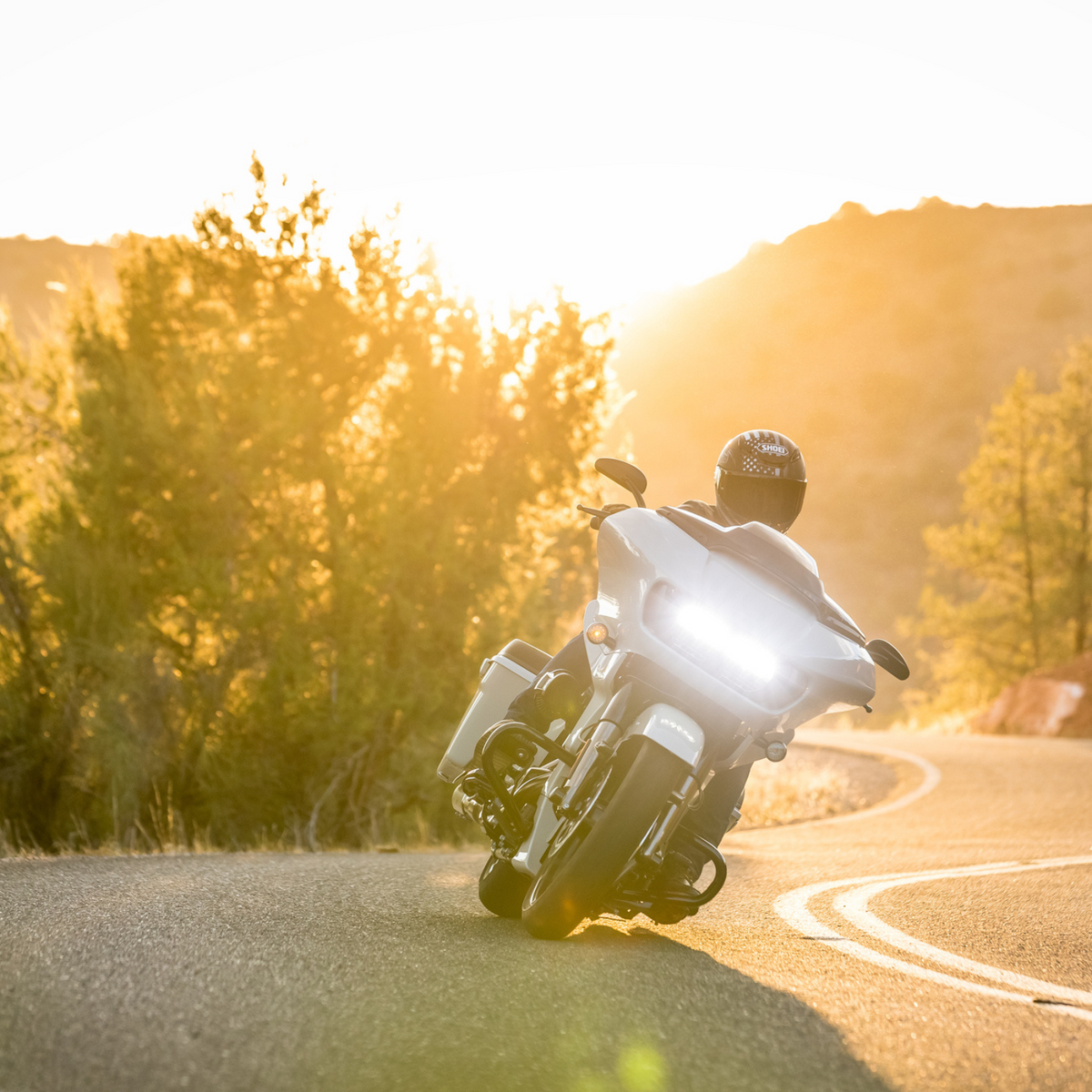 Shoei RF-1400 Dedicated 2 TC-5 matte black and white helmet, rider cornering on motorcycle