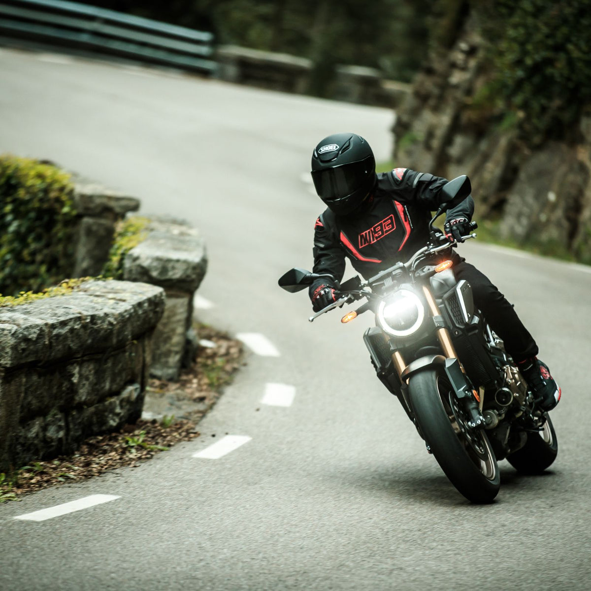 Shoei RF-1400 Solid helmet - Matte Black on-road riding view