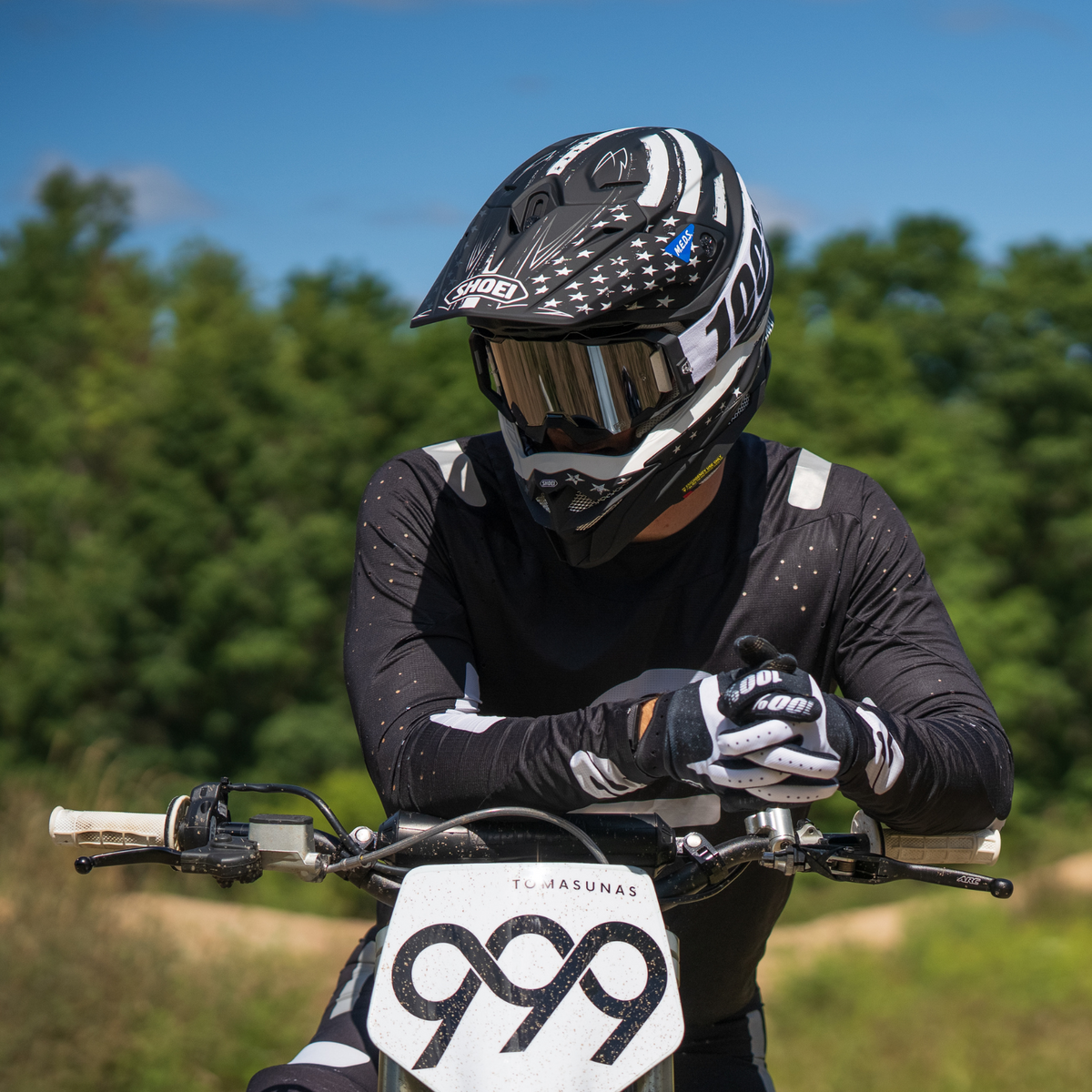 SHOEI VFX-EVO Faithful 2 TC-5 black and white, front view of helmet worn with motocross goggles