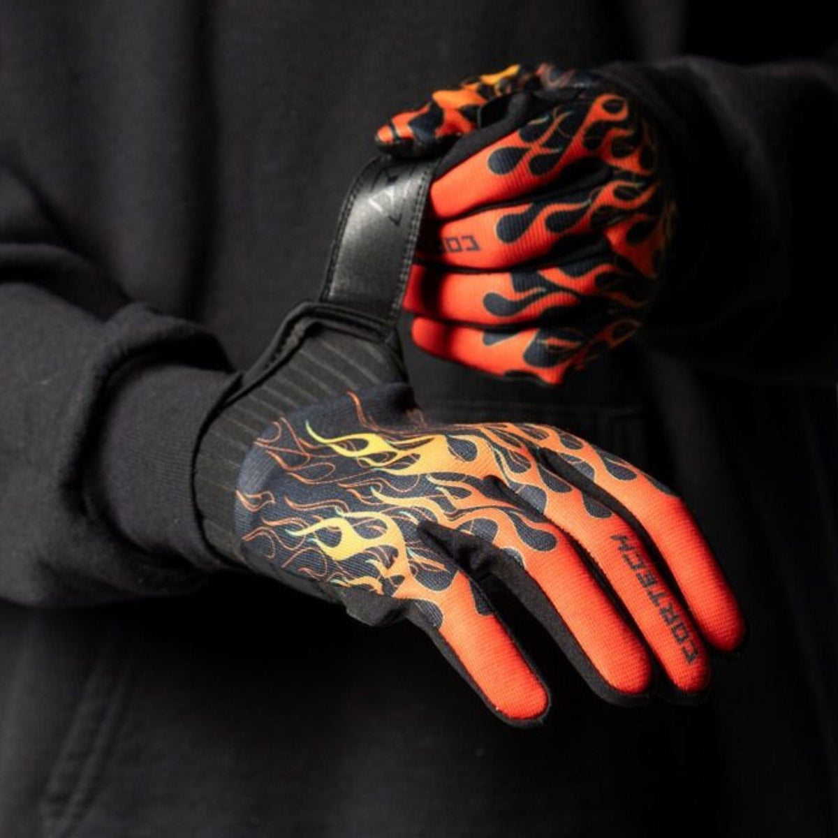 Cortech Standard Issue Flame Gloves, rider fastening the glove