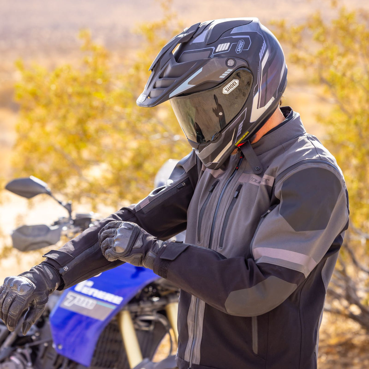Tourmaster Adventure Lite Jacket in Gray / Black, worn on an adventure motorcycle