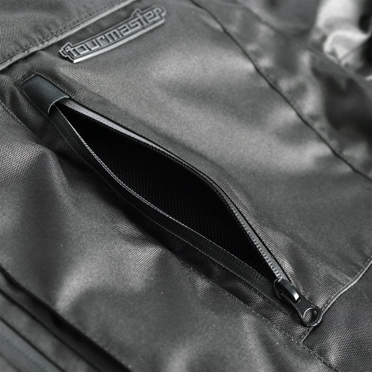 Tourmaster Centurion Lite black one-piece suit, zippered ventilation detail