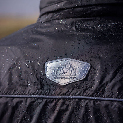 Tourmaster Defender Two-Piece Rainsuit in Black - rear collar detail with water droplets