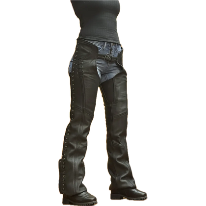 Women's black leather motorcycle chaps with lace-up sides, silver grommets, and adjustable front belt, worn over denim jeans and paired with black boots.